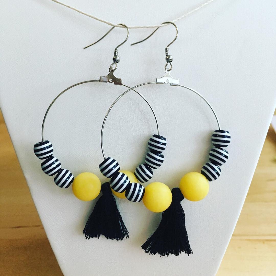 Simple Alabaster & striped Acrylic beads on Stainless Steel hoops make up this pair.