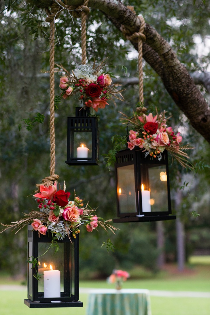 Add a pop of color to hanging lanterns with some spring blooms and greenery.