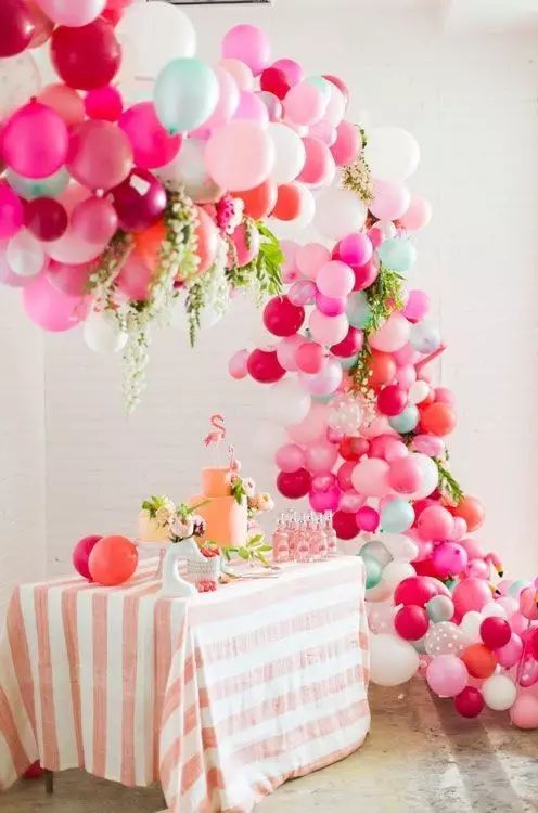 #Wedding #Decoration #Balloons Colorful balloons and domes made of tropical leaves decorate the dessert table