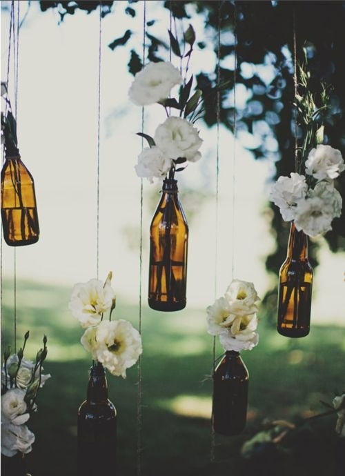 Mason Jars, keep leftover wine bottles to act as easy and affordable hanging vases.