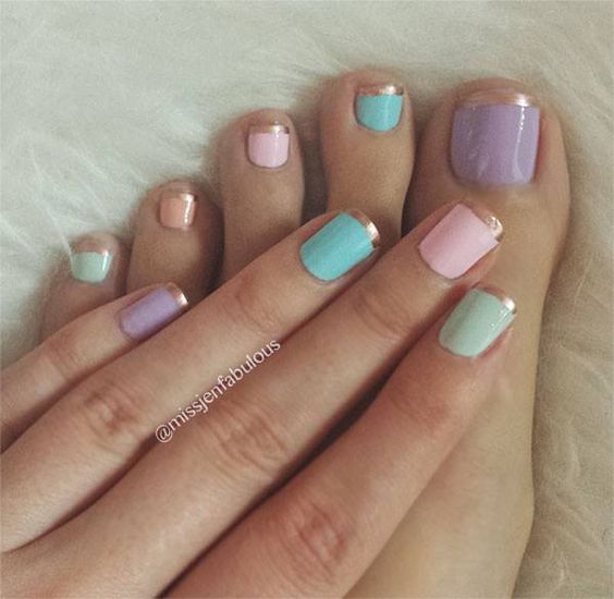 Multi coloured nails and toes with beige tips.