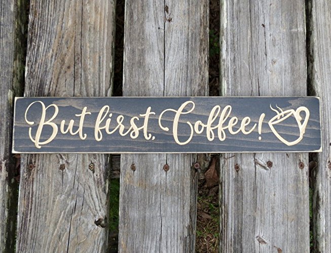 The but first coffee sign has been stained ebony