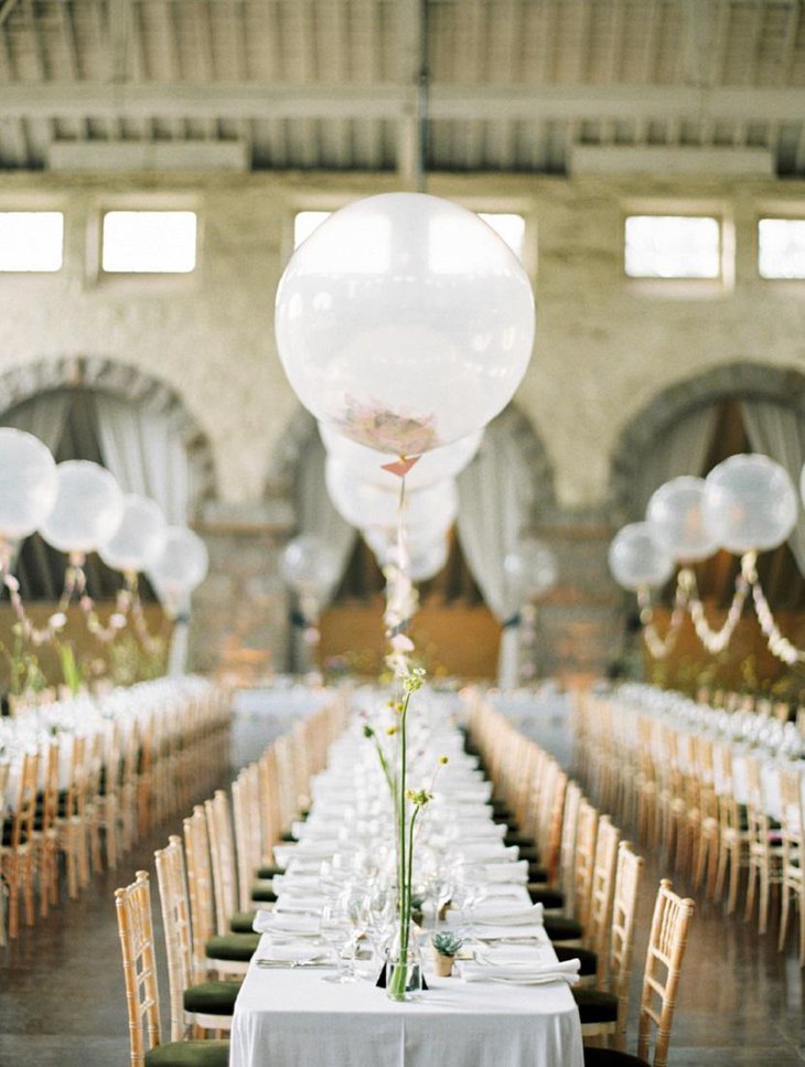 White Balloon, Floral Arrangements, and String Light Arches