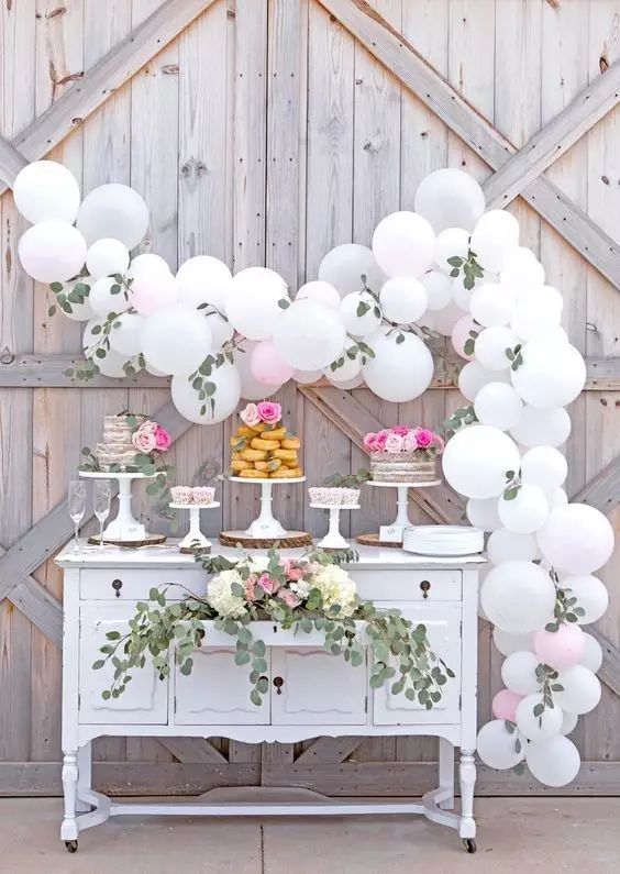 #Wedding #Decoration #Balloons decorated with white balloons and green plants made of curved ornaments to the dessert table