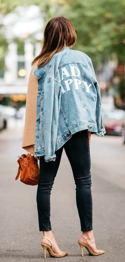 Gray denim jacket, black skinny jeans and pair of brown pumps.