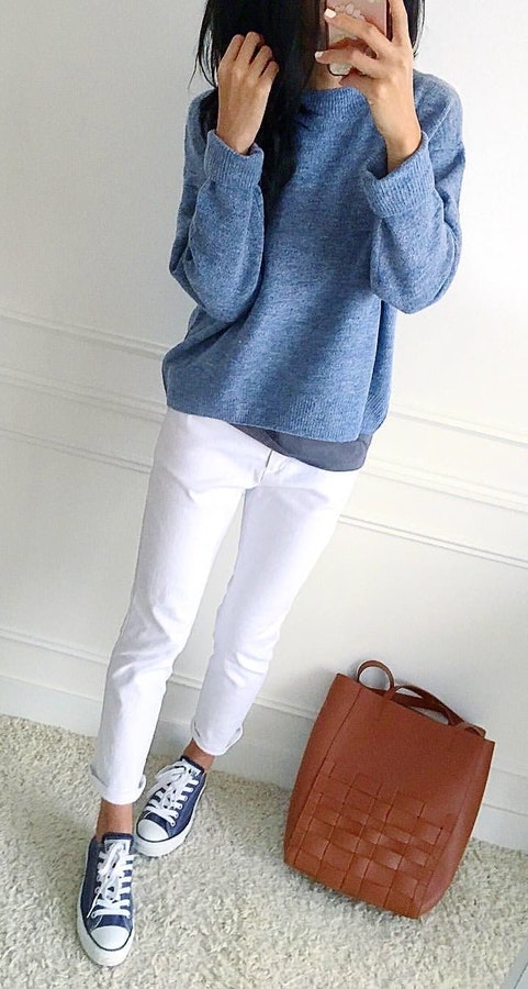 Gray long-sleeved crew-neck sweater and white pants.