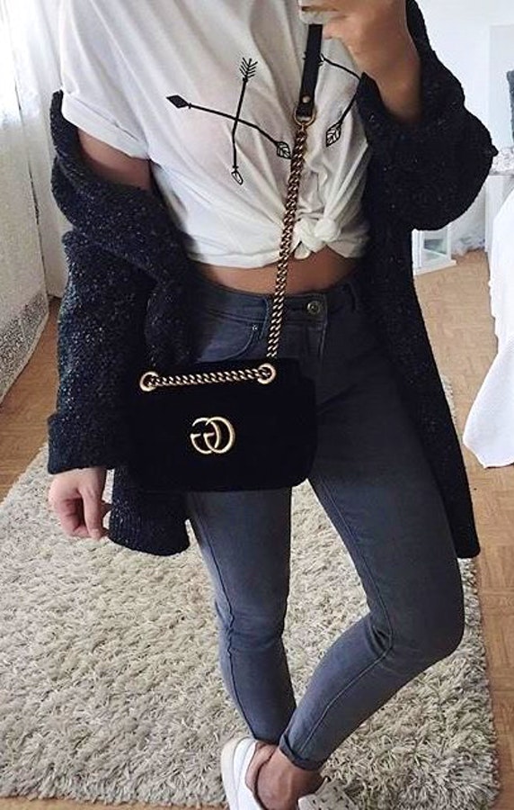 Women's black Gucci crossbody bag.