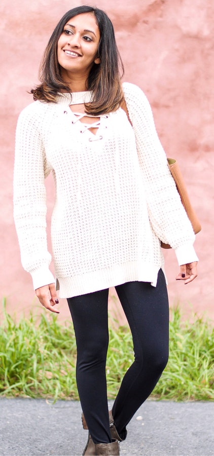 Women's white knitted crew-neck sweater.