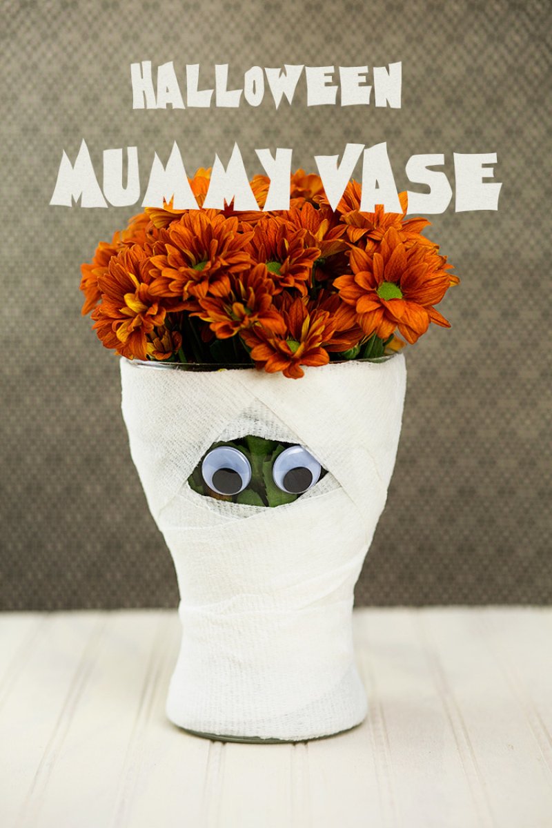 Wrapping a vase with gauze and adding craft eyes creates such a fun centerpiece.