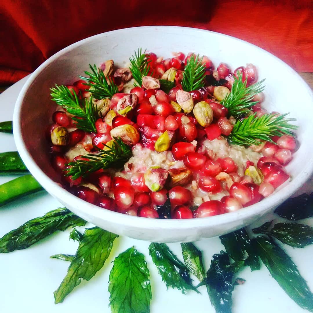 Oatmeal topped with pine, pomegranate , pistachio and a bit of lime juice.