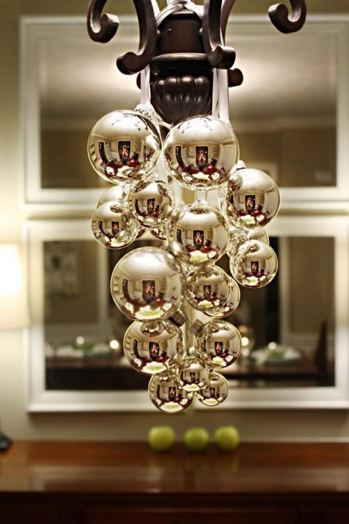 An original way to dress our chandeliers and lights for the holidays by hanging balls.