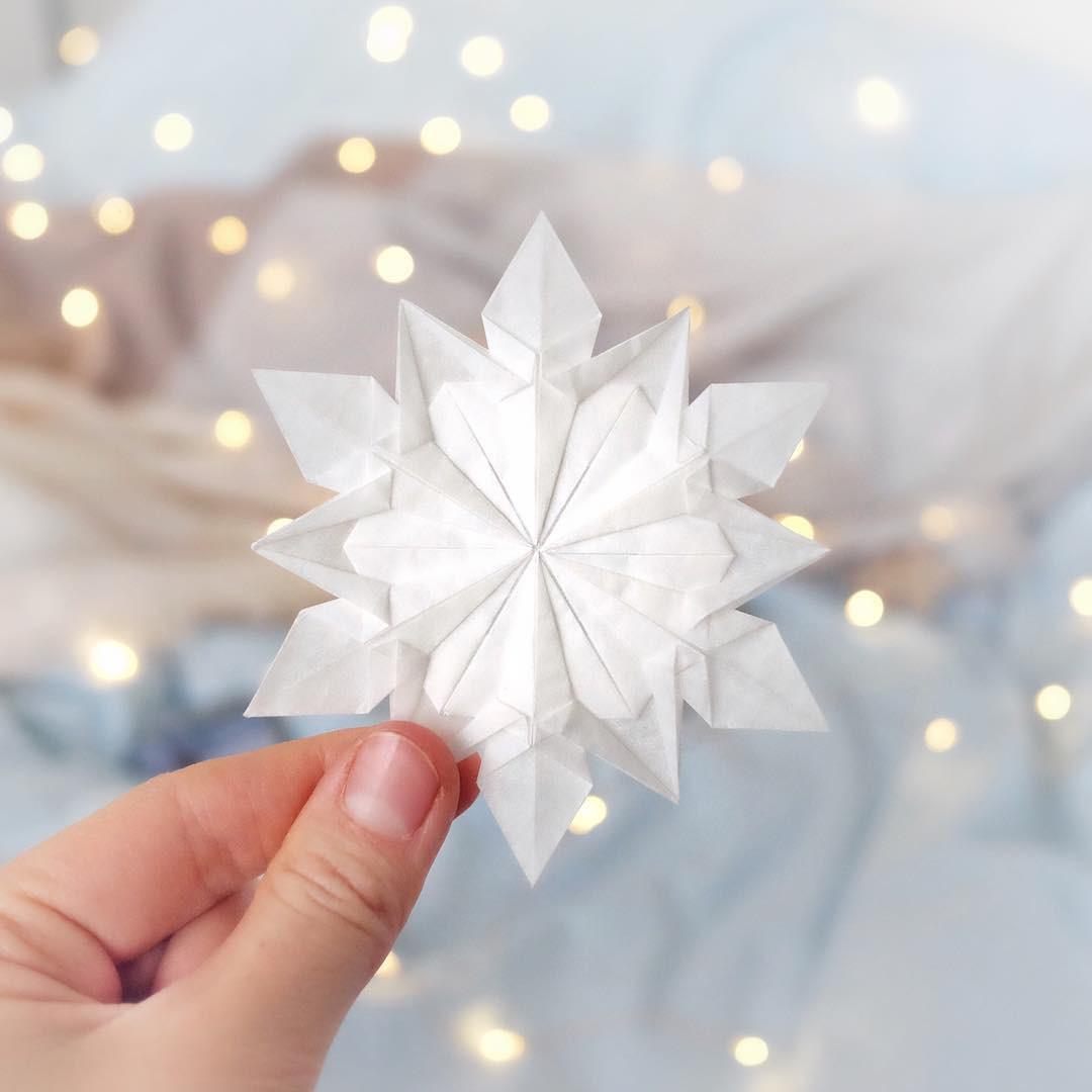 Christmas Origami Stars hold the picture and story of a family or individual.