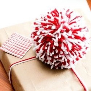 DIY Pom poms and wool string are a super cute way to wrap your presents!