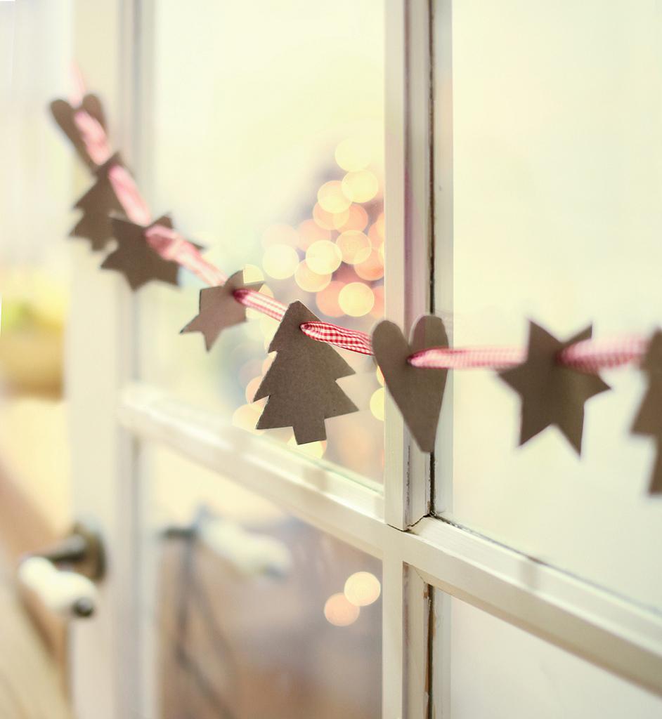 Garlands with a ribbon and shapes cut out of construction paper.