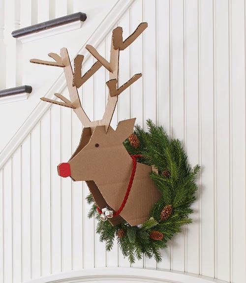 This red nose reindeer made of cardboard will make a sensational effect in your living room.