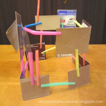 Building cardboard structures.