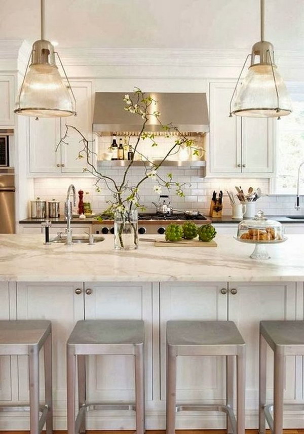 Crisp White Kitchen with A Pair of Glass Pendant Lignts.