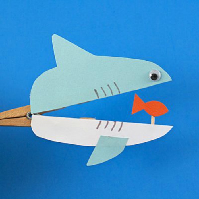 Cute shark clothespin craft.