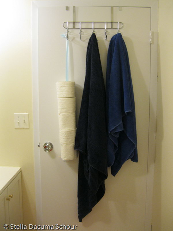 Hang your toilet paper rolls behind the bathroom door.