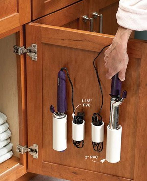 PVC pipe storage for curling irons and cords.