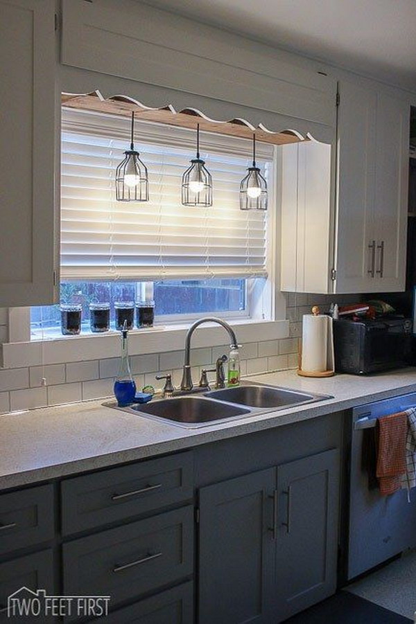 Pendant Cage Light with a Wooden Box Above the Sink.
