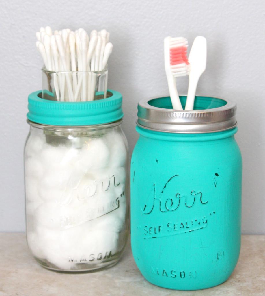 Paint mason jars to hold toothbrushes.