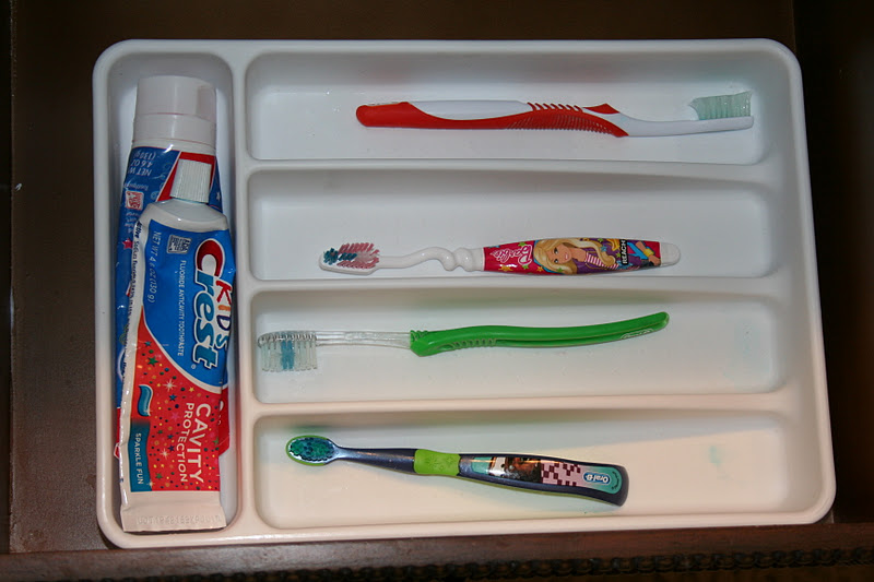 Use a silverware organizer as a family toothbrush holder! Dollar Store Organization