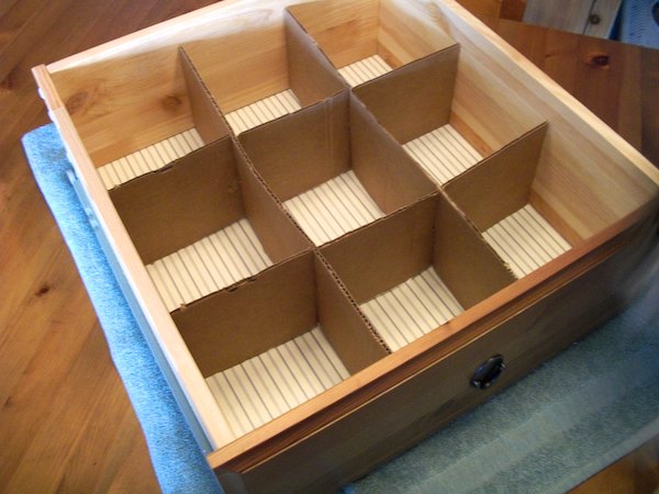 Cardboard to make your own drawer divider.