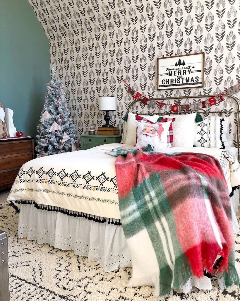 Christmas Bedroom with Santa Pillow and Plaid Blanket.