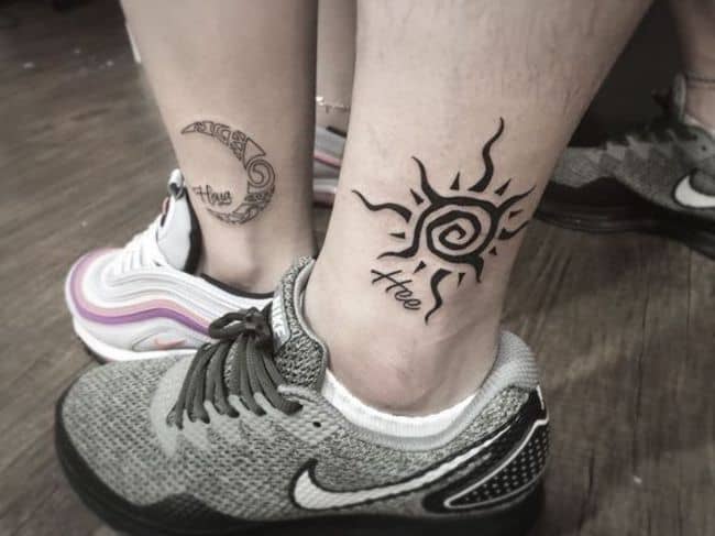 Solar and Luna ankle tattoos.