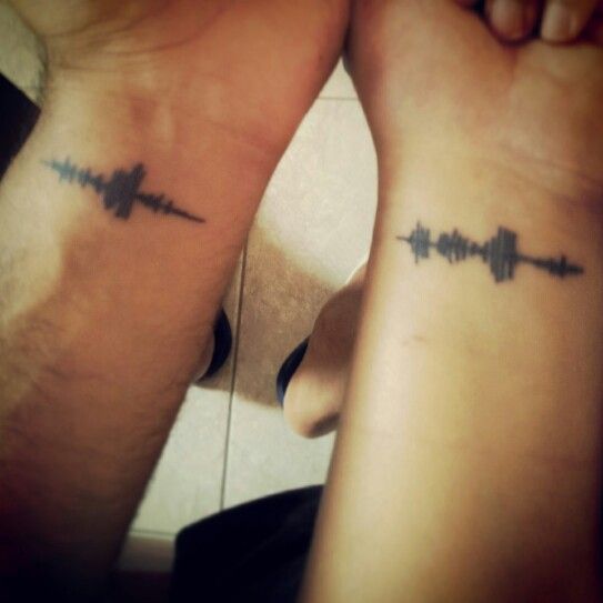 Sound wave couples tattoo of “I Love You” spoken to each other.