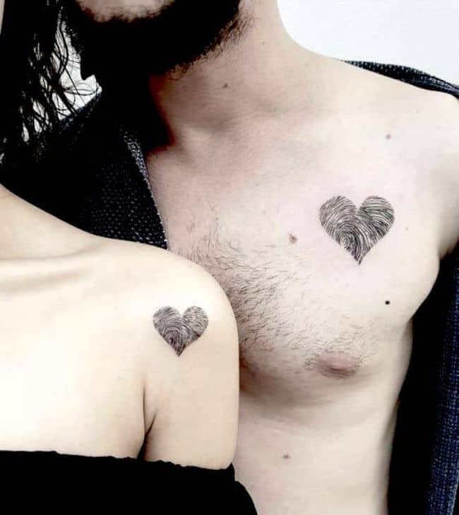 The fingerprinted heart couple tattoos.