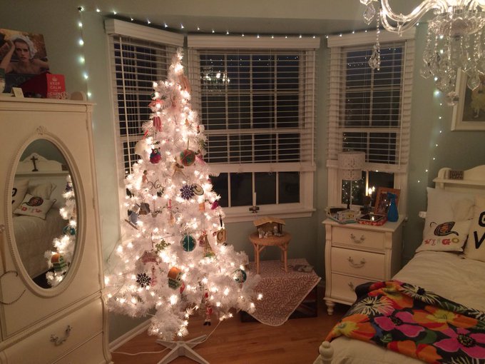 When you love Christmas so much you gotta have a full size tree in your bedroom.