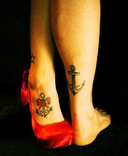 his and her matching anchor tattoos.