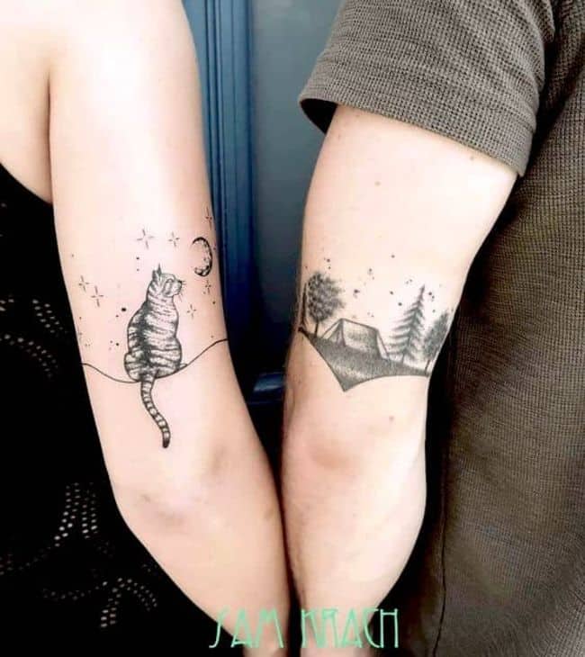 “Under the same sky” couple tattoos on the arm.