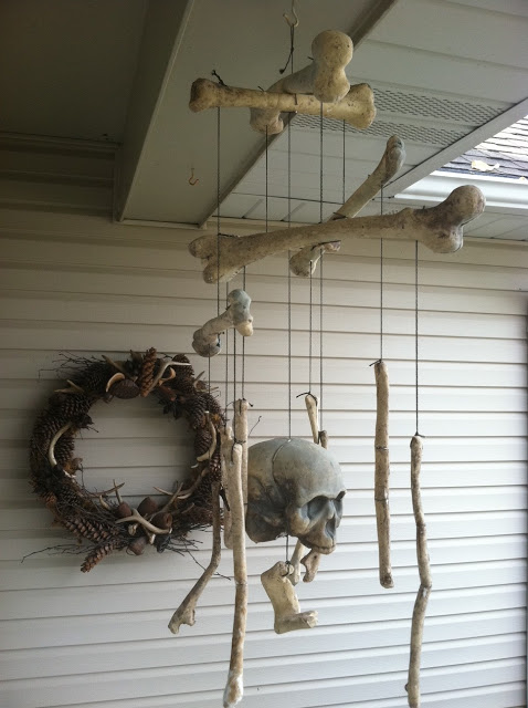 Drill a hole and string them up to craft a creepy bone mobile for your front porch.