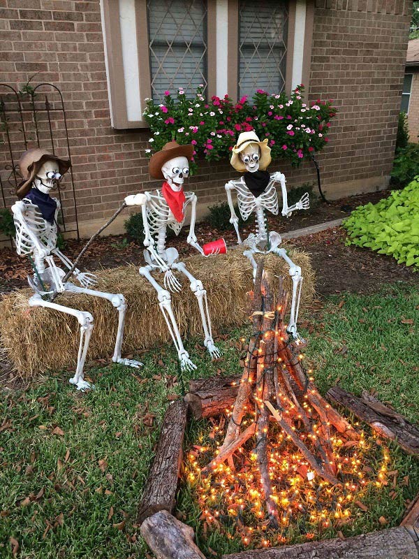 Three plastic cowboy skeletons gathered around the campfire.